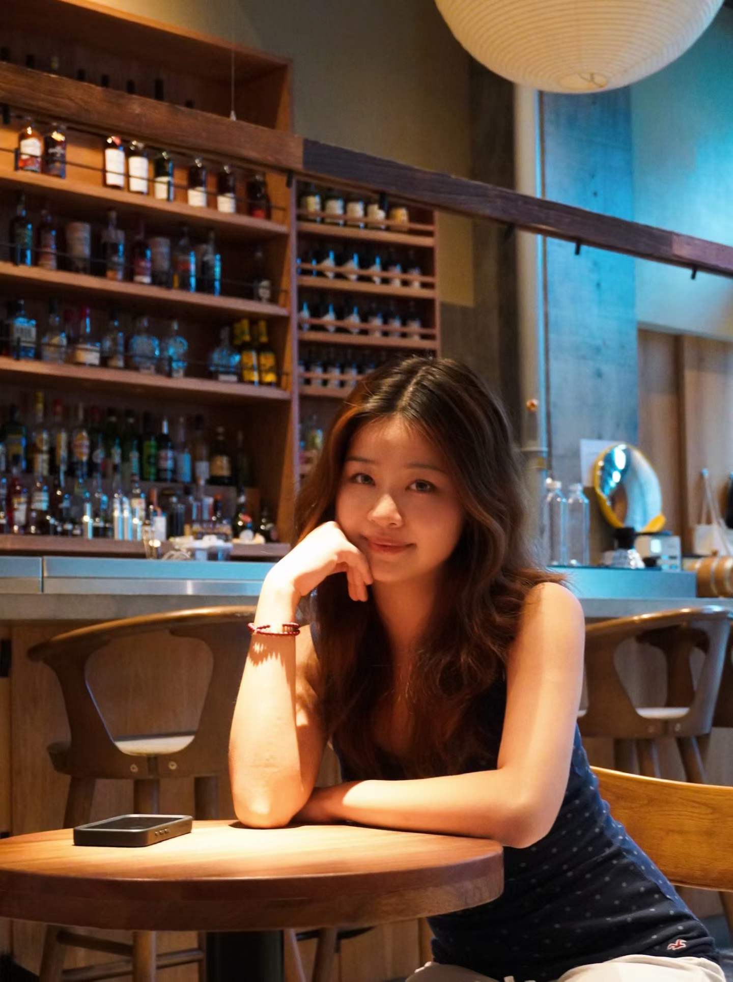 Mia Ding sitting in a café